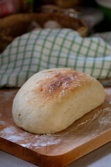 Freshly baked homemade bread on a rustic wooden background