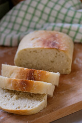 Freshly baked homemade bread on a rustic wooden background