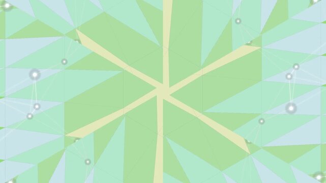 A colorful geometric pattern featuring various shades of green and beige, adorned with pearl-like decorations, forming a symmetrical design on a white background