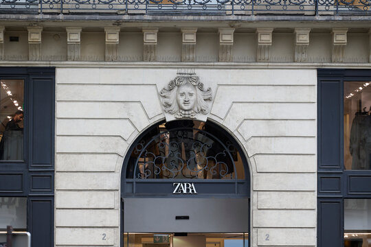 Zara fashion boutique entrance in historic Haussmann building facade in Paris. Retail, shopping and European luxury city lifestyle concept. Paris, France - October 13, 2025.