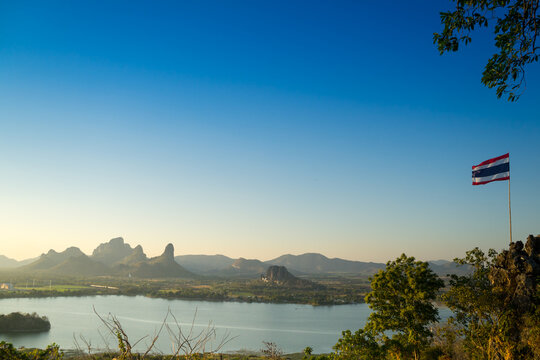 A spectacular viewpoint, hiking spot that overlooks Sub Lek reservoir, hence the name. Quite a strenuous hike is required at Lopburi Province, Thailand. View of mountain and lake on sunset.