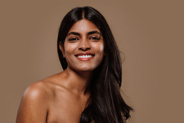 Professional beauty studio portrait on a young indian woman with long dark hair