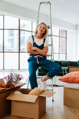 Single woman relocating in a new apartment