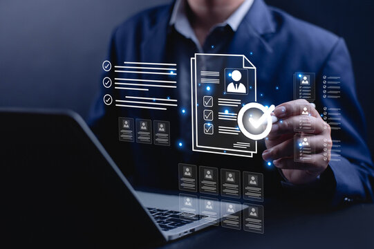 Businessman reviewing digital resume and candidate profile on laptop with approval check mark, representing recruitment process, HR management, job application screening, talent acquisition concept.