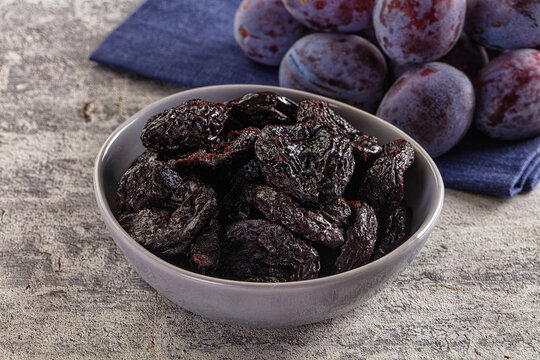 Black dry sweet prunes heap