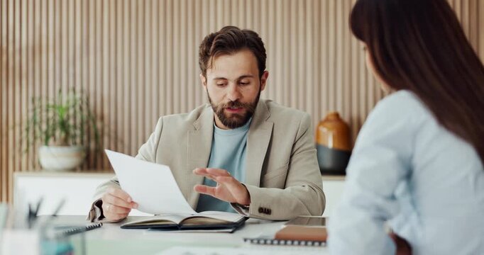 Man, people and talk in office with paperwork, marketing insight or planning for brand management. Person, team and document in meeting for advertising strategy, creative collaboration or discussion.
