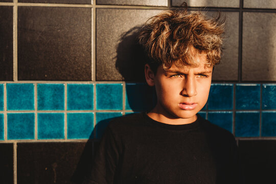 Portrait of a boy with sun hitting his hazel eyes.