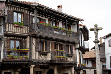 Traditional building with wooden balconies and flowers.. La Alberca, in the province of Salamanca, Spain
