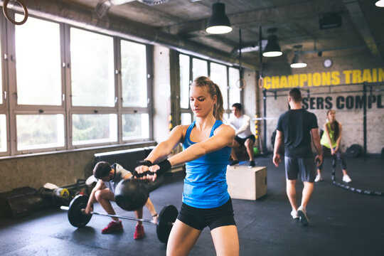 Group of young people exercising in gym