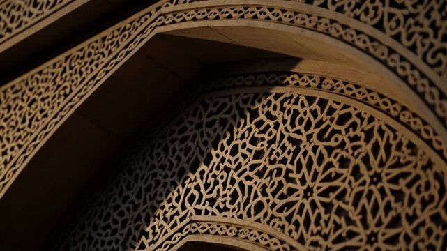 Intricate Islamic archway with ornate floral patterns and calligraphy