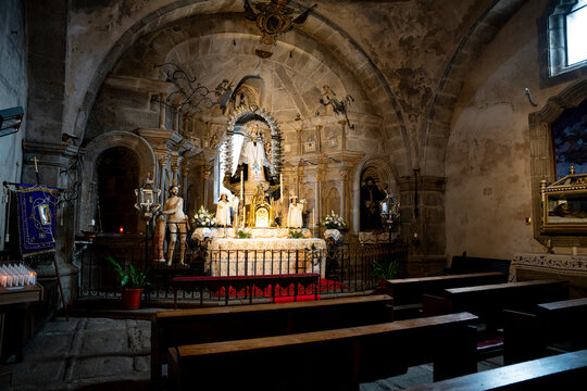 Interior of a church with an altar and pews.. Parish Church of Our Lady of the Assumption in La Alberca, Salamanca, Spain