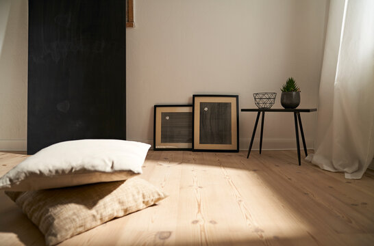 Interior in a modern furnished room with wooden floor