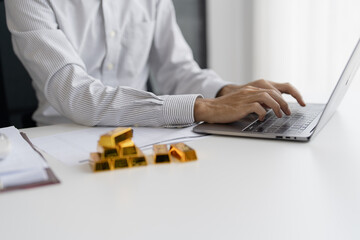 Gold bar Trading business people hand offering gold&nbsp;Investment in gold mining company or Trading gold on the stock exchange&nbsp;Rising prices.