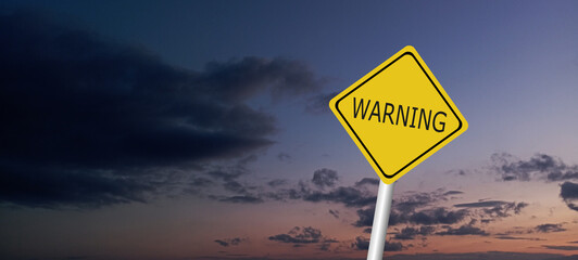 Hurricane Idalia warning sign against a powerful stormy background with copy space. Dirty and angled sign with cyclonic winds add to the drama.hurricane season sign on cloudy background