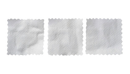 Three rectangular, textured white patches with jagged edges against black