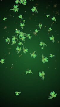 abstract vertical green background with falling shamrock leaf and glittering stars