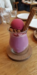 Purple smoothie with berry sorbet and churro