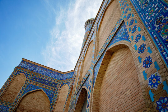 Beautiful Gur-e-Amir Mausoleum in Samarkand, Uzbekistan. Exterior view on sunny day. Guri Amir. With "Allah is great" in arabic.