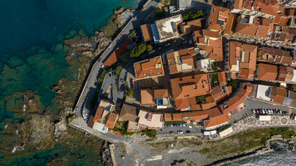Aerial zenithal view of a Italian seaside town, with a dense network of ancient houses. It is the historic center of Diamante, in province of Cosenza, Calabria, Italy. It overlooks the Tyrrhenian Sea. © Stefano Tammaro