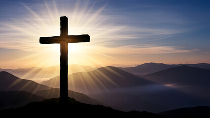 Cross on a hill at sunrise with mountains