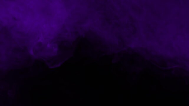 Realistic purple fog or smoke rising from the bottom of the frame. Isolated on black, perfect for compositing ground fog or a mysterious reveal