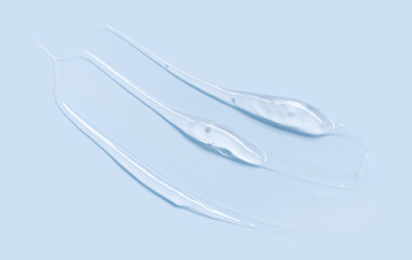 Fototapeta premium cosmetic texture gel essence smear on a blue background