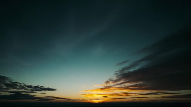 Glowing sun breaking through light clouds at the horizon, casting warm sunbeams and pastel colors across the sky for an inspiring, peaceful dawn or dusk atmosphere