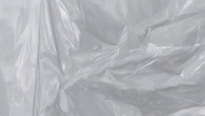 Clear plastic film background, abstract texture with light reflections and soft wrinkles
