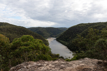 Beautiful view of river flowing between green valleys.