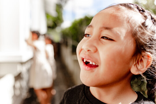Close up of Samoan with tooth gap outdoors
