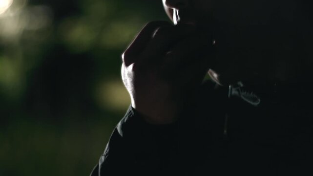 Man eating apple late at night