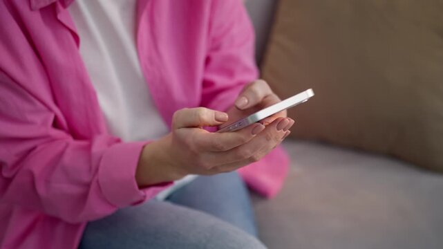 Close up unknown Caucasian woman at home typing mobile phone texting female girl user chatting business customer using smartphone social media apps buy ordering goods online shopping indoors apartment