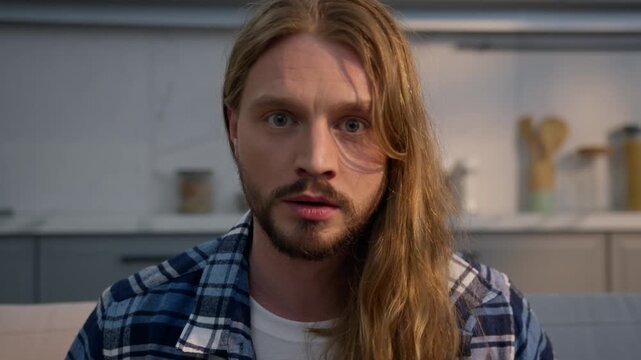 Angry furious Caucasian man at home yelling screaming male frustrated mad aggressive guy upset dissatisfied shout looking camera quarrel conflict trouble problem bad emotion nervous video call indoors