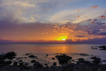 Dramatic sunset over rocky Pacific coastline along Shikoku Henro pilgrimage route, Japan