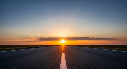 Empty asphalt road stretching towards the horizon under a vibrant sunset sky © Mimie