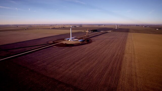 Drone shot revolving around wind turbines in early build phase