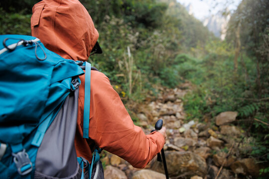 Successful backpacker hking in the  mountains