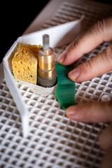 a man is grinding a piece of glass