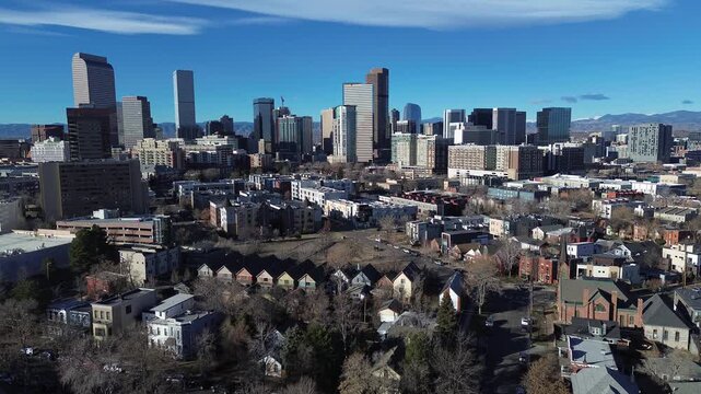 Hale neighborhood corridors extend toward commercial zones and downtown skylines, towers along Colorado Boulevard. Gentle lighting defines shingles, brickwork, dormant tree patterns in Denver