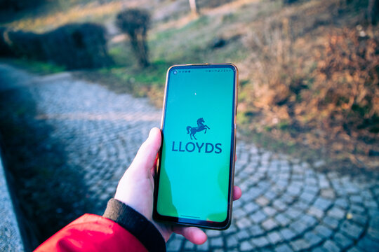 person opening Lloyds banking app on a phone