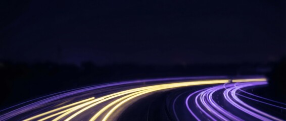 Fototapeta premium Long-exposure motion blur of neon city lights, with vibrant yellow and magenta streaks, capturing dynamic urban energy for web banners, modern branding, and digital design.
