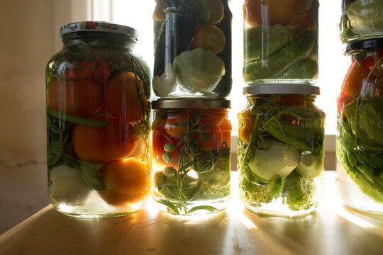 Homemade fermented vegetables in glass jars for winter preservation