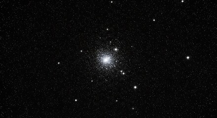 Fototapeta premium A dense cluster of stars, brightly illuminating a dark, speckled, cosmic background