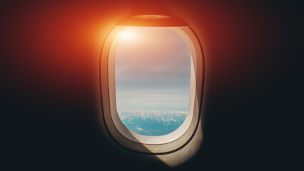 Airplane window view with blue sky and ocean horizon during flight travel concept, Aviation porthole perspective showing serene sky landscape from passenger cabin journey