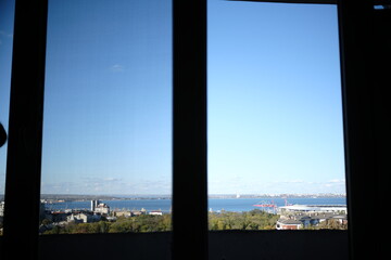 view from the window with sea in city 