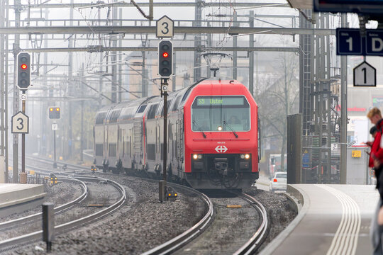 S-Bahn train number 9 destination Uster arriving at Swiss city of village of Oberglatt on a foggy winter day. Photo taken February 19th, 2026, Zurich Oberglatt, Switzerland.