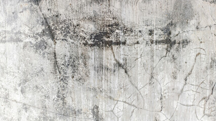 Fototapeta premium Abstract textured background with cracks and stains resembling a weathered concrete wall
