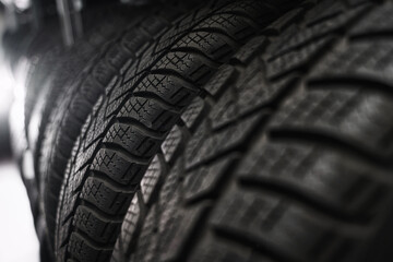 tire at repairing service garage background. Car tire in warehouse. Transportation and automotive maintenance concept