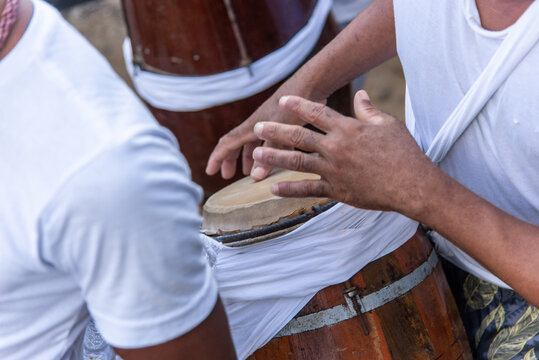 Members of a Candomble practitioner are seen with percussion instruments