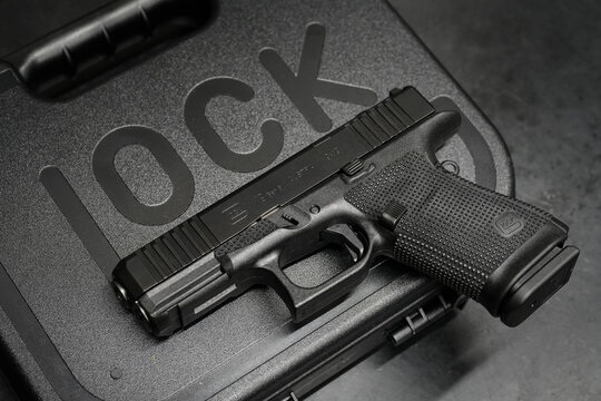 TALLINN, ESTONIA - FEBRUARY 19, 2026: A Glock 17 Gen 6 pistol displayed on a detailed lubrication and maintenance guide mat.